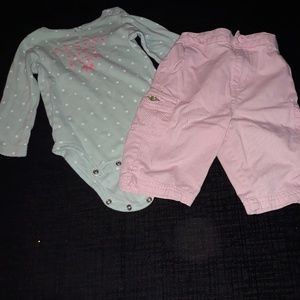 A long-sleeve one-piece and pink shorts